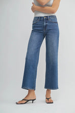 Load image into Gallery viewer, Person wearing blue jeans on a plain background