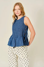Load image into Gallery viewer, Woman wearing a blue smocked top and polka dot pants on a beige background