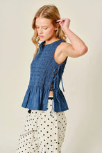 Load image into Gallery viewer, Woman wearing a blue smocked top with a beige background