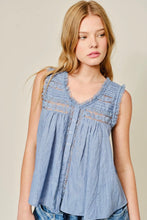 Load image into Gallery viewer, Woman wearing a sleeveless denim top with lace details on a beige background