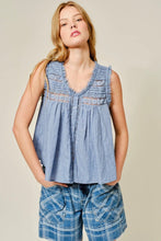Load image into Gallery viewer, Woman wearing a sleeveless denim top with a beige background