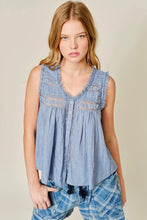 Load image into Gallery viewer, Woman wearing a sleeveless denim top with lace details on a beige background