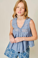 Load image into Gallery viewer, Woman wearing a sleeveless denim top with plaid shorts on a beige background