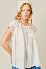 Load image into Gallery viewer, Woman wearing a white lace top and beanie against a plain background