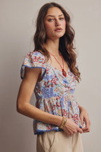 Load image into Gallery viewer, Woman wearing a floral blouse against a plain background