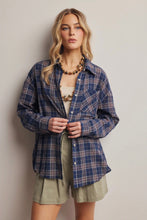 Load image into Gallery viewer, Woman wearing a blue plaid shirt over a white top and green shorts against a plain background