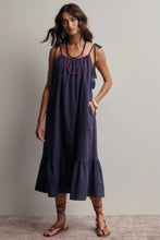 Load image into Gallery viewer, Woman wearing a navy blue dress with a plain background