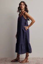 Load image into Gallery viewer, Woman wearing a navy blue dress with brown sandals against a plain background