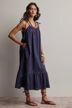 Load image into Gallery viewer, Woman wearing a navy blue dress with a plain background