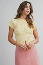 Load image into Gallery viewer, Woman wearing a yellow ribbed sweater and pink skirt on a plain background