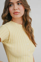 Load image into Gallery viewer, Woman wearing a light yellow ribbed sweater against a plain background