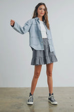 Load image into Gallery viewer, Woman wearing a denim jacket, white shirt, checkered skirt, and black sneakers on a plain background