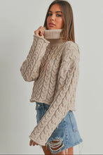 Load image into Gallery viewer, Woman wearing a beige cable knit sweater and denim skirt on a plain background