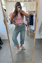 Load image into Gallery viewer, Person taking a mirror selfie wearing a striped tank top and jeans in a clothing store.