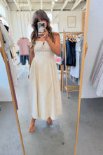 Load image into Gallery viewer, Person wearing a white dress standing in a clothing store.
