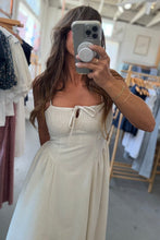 Load image into Gallery viewer, Woman taking a mirror selfie wearing a white dress in a clothing store.