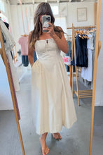 Load image into Gallery viewer, Woman taking a mirror selfie wearing a white dress in a clothing store.