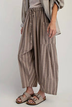 Load image into Gallery viewer, Person wearing striped wide-leg pants and sandals on a plain background