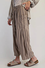 Load image into Gallery viewer, Person wearing striped pants and sandals on a plain background