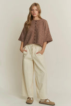 Load image into Gallery viewer, Woman wearing a brown knitted top and beige pants against a plain background