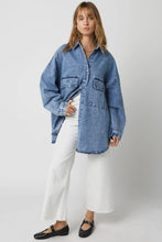 Load image into Gallery viewer, Person wearing a blue denim shirt over a white top with white pants on a plain background