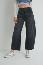Load image into Gallery viewer, Person wearing black wide-leg jeans and white sneakers on a plain background