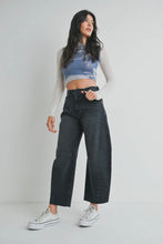 Load image into Gallery viewer, Woman wearing a tie-dye crop top and black jeans on a plain background
