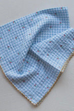Load image into Gallery viewer, Blue checkered fabric with a subtle pattern on a light gray background
