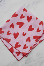 Load image into Gallery viewer, Pink fabric with red heart pattern on a marble surface