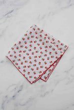 Load image into Gallery viewer, Two folded napkins with a strawberry pattern on a marble surface
