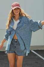 Load image into Gallery viewer, A woman wearing a light blue oversized denim shirt, denim shorts, a white t-shirt, and a dusty pink baseball cap, standing outdoors against a light gray wall.