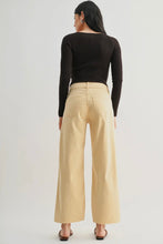Load image into Gallery viewer, Person wearing beige pants and a black top on a white background