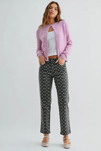 Load image into Gallery viewer, Woman wearing a pink cardigan, white top, and polka dot pants on a light gray background