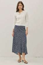 Load image into Gallery viewer, Woman wearing a white cardigan and blue floral skirt on a plain background