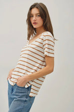 Load image into Gallery viewer, Woman wearing a striped shirt and jeans against a plain background