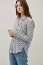 Load image into Gallery viewer, Woman wearing a striped shirt and jeans against a plain background