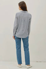 Load image into Gallery viewer, Person wearing a striped shirt and blue jeans on a plain background