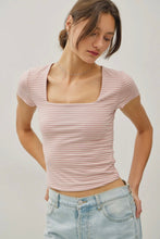 Load image into Gallery viewer, Woman wearing a pink striped top and light blue jeans against a plain background