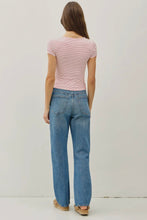 Load image into Gallery viewer, Person wearing a striped shirt and blue jeans against a plain background