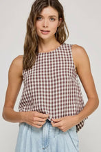 Load image into Gallery viewer, Woman wearing a checkered sleeveless top and light blue jeans against a plain background