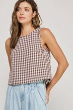 Load image into Gallery viewer, Woman wearing a checkered sleeveless top and light blue jeans on a plain background