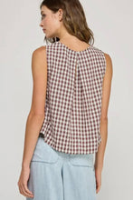 Load image into Gallery viewer, Woman wearing a sleeveless checkered top and light blue pants on a plain background