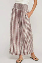 Load image into Gallery viewer, Person wearing plaid wide-leg pants on a plain background