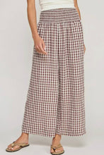 Load image into Gallery viewer, Person wearing a pair of checkered pants on a plain background
