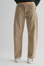 Load image into Gallery viewer, Beige jeans worn by a person on a plain background