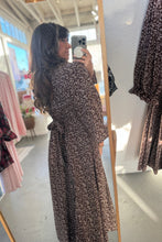 Load image into Gallery viewer, Woman taking a mirror selfie wearing a long floral dress in a store.