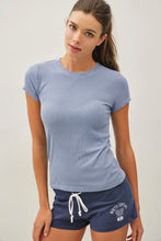 Load image into Gallery viewer, A woman modeling a light blue short-sleeve crewneck t-shirt and navy blue athletic shorts with a white drawstring and 'Water Central' text on the leg.