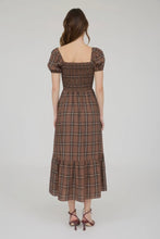 Load image into Gallery viewer, Woman wearing a brown plaid dress on a white background