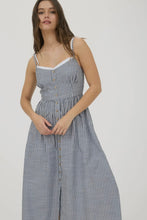 Load image into Gallery viewer, Woman wearing a striped dress on a plain background