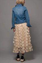 Load image into Gallery viewer, Person wearing a denim jacket and beige skirt with circular patterns on a gray background